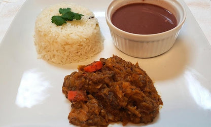 Legume and sauce pwa comes with white rice, fried green plantains and tossed salad